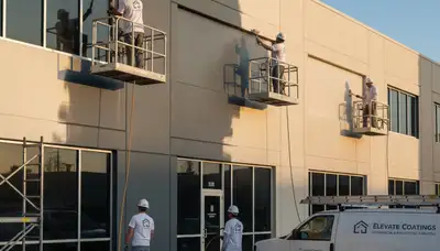 Professional commercial painters finishing office exterior in Chattanooga, TN