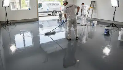 Epoxy garage floor coating in Chattanooga, TN with durable, glossy finish by local painting experts