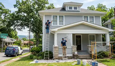 Professional house painters working on residential exterior in Chattanooga, TN