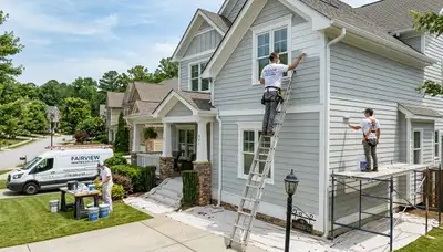 Professional house painters finishing exterior home in Chattanooga, TN