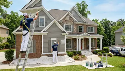 Professional house painters working on home exterior in Chattanooga, TN