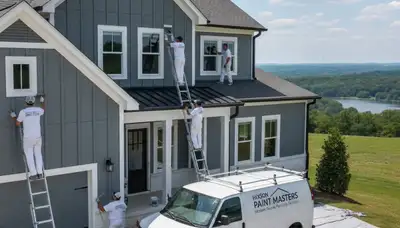 Professional house painters finishing residential exterior in Chattanooga, TN
