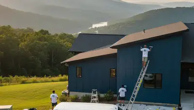 Professional house painters finishing exterior home in Chattanooga TN