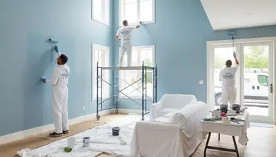 Professional interior house painters in Chattanooga TN applying fresh color to living room walls